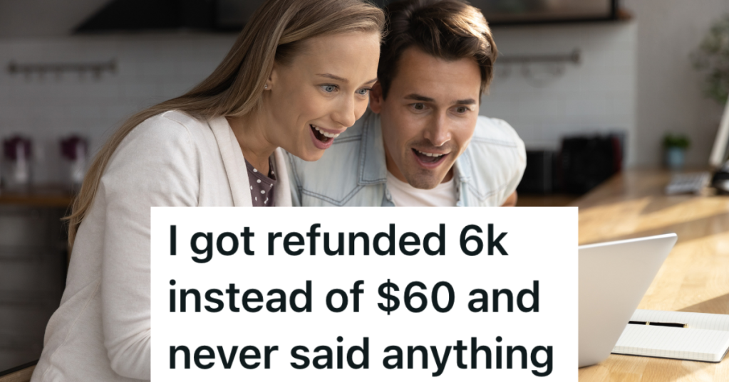 couple happily looking at computer