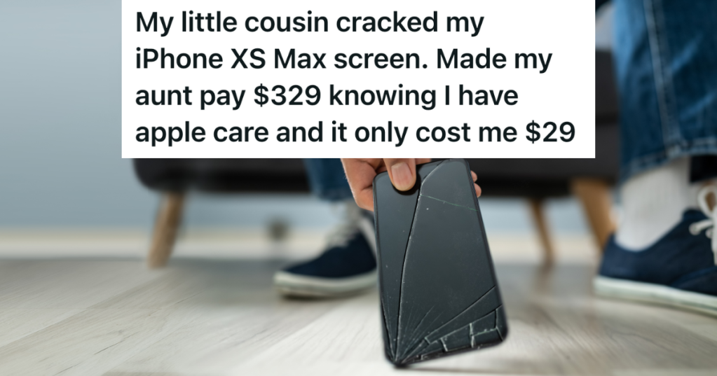 closeup of a person picking up a phone with a broken screen