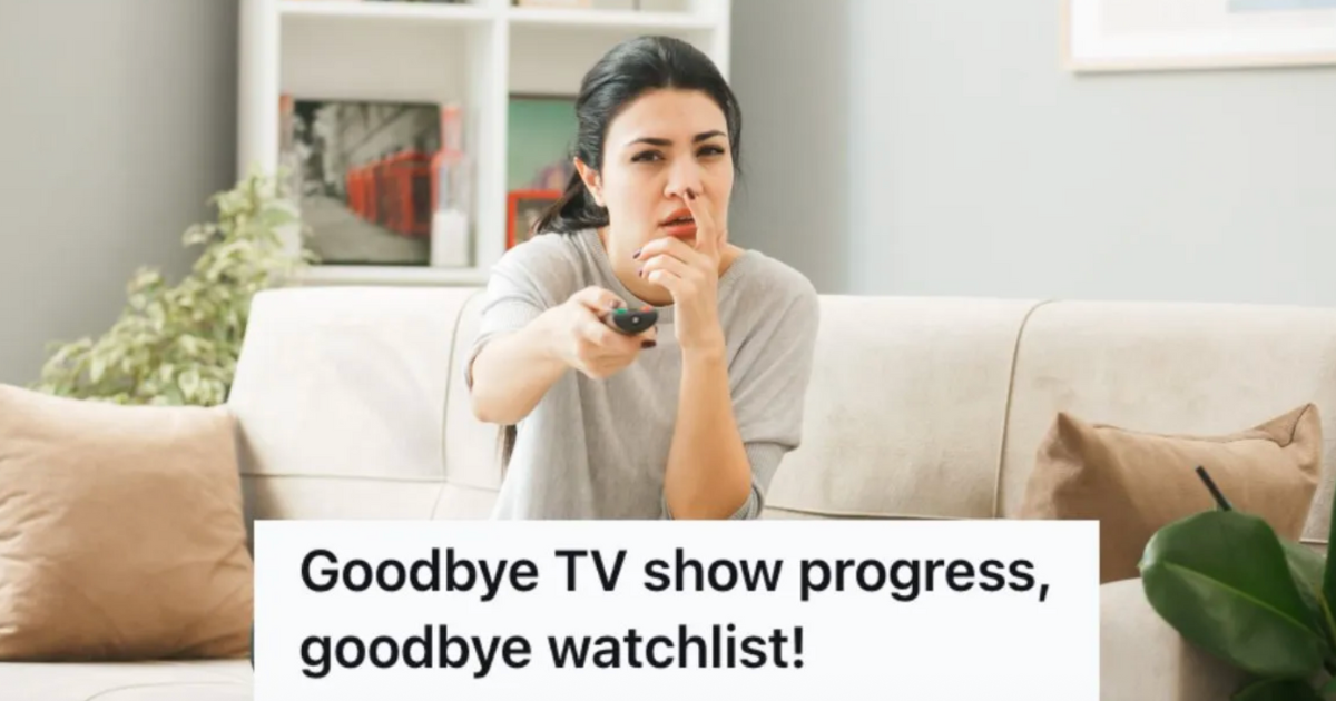 woman pointing a remote at a TV