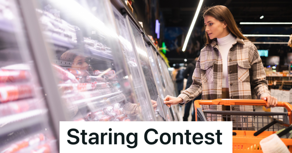woman looking at meat in the grocery store