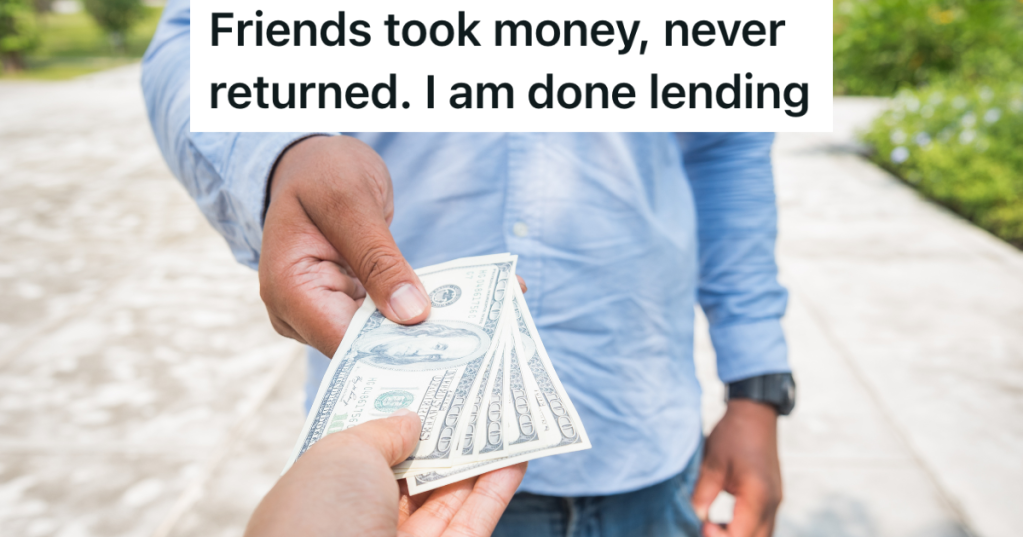 man handing another man cash