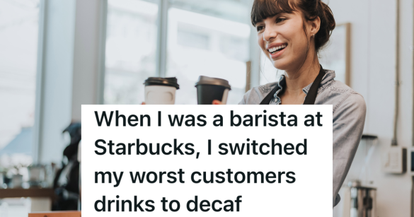 smiling female barista holding two coffee cups