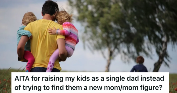 dad carrying two little kids outside