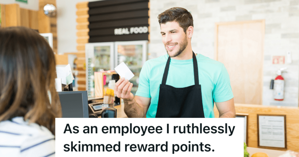 smiling cashier holding rewards card
