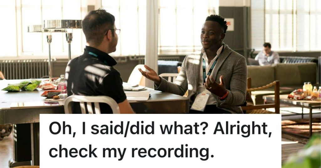 Men talking seriously at a desk