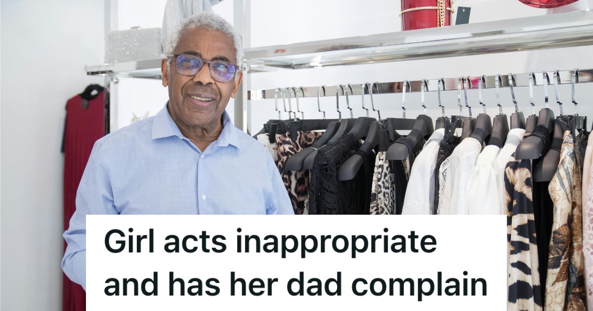 Retail worker standing in front of clothes