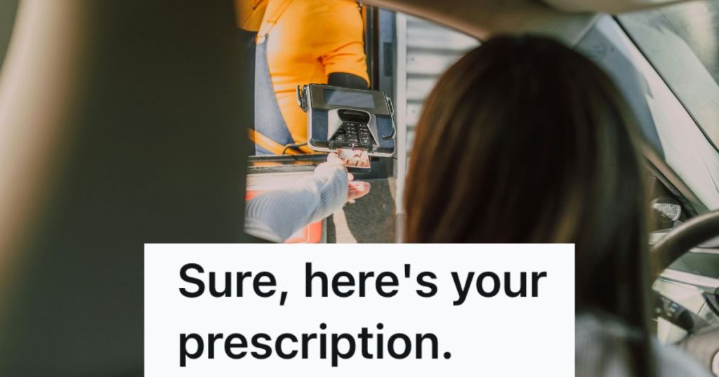 Woman paying at a drive thru