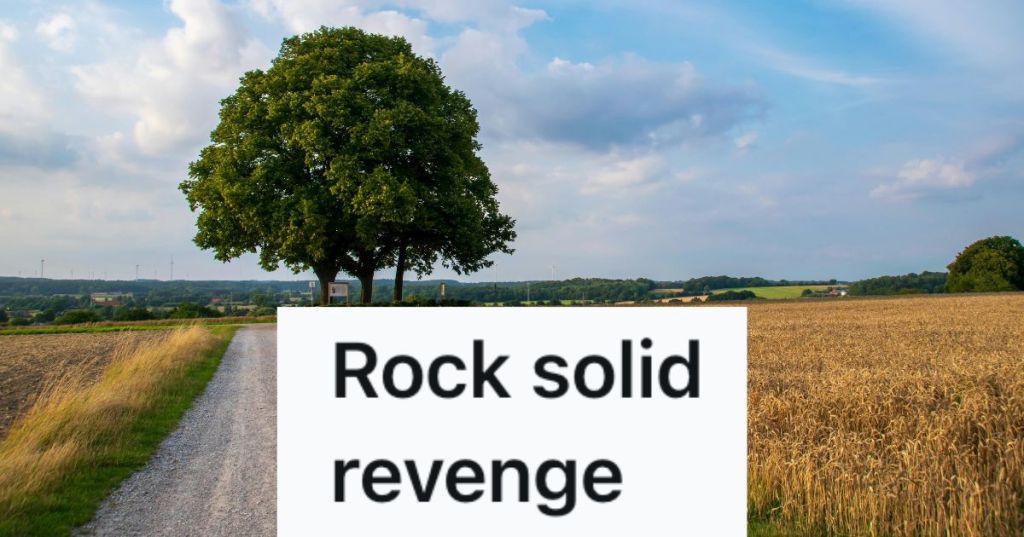 A large tree by a dirt road