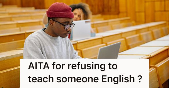 Man typing on laptop in a lecture hall