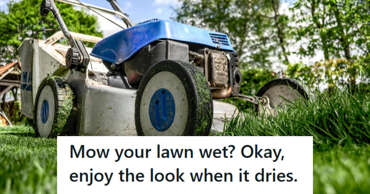 Push lawn mower sitting in wet grass with clumps on the wheels