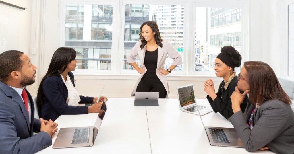Five employees in a meeting