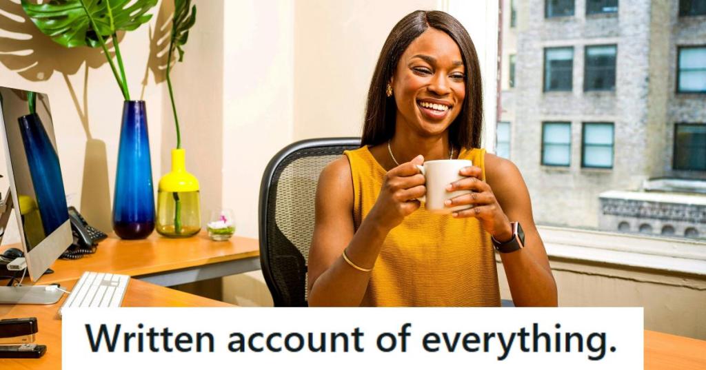 African American lady smiling at her desk after malicious compliance