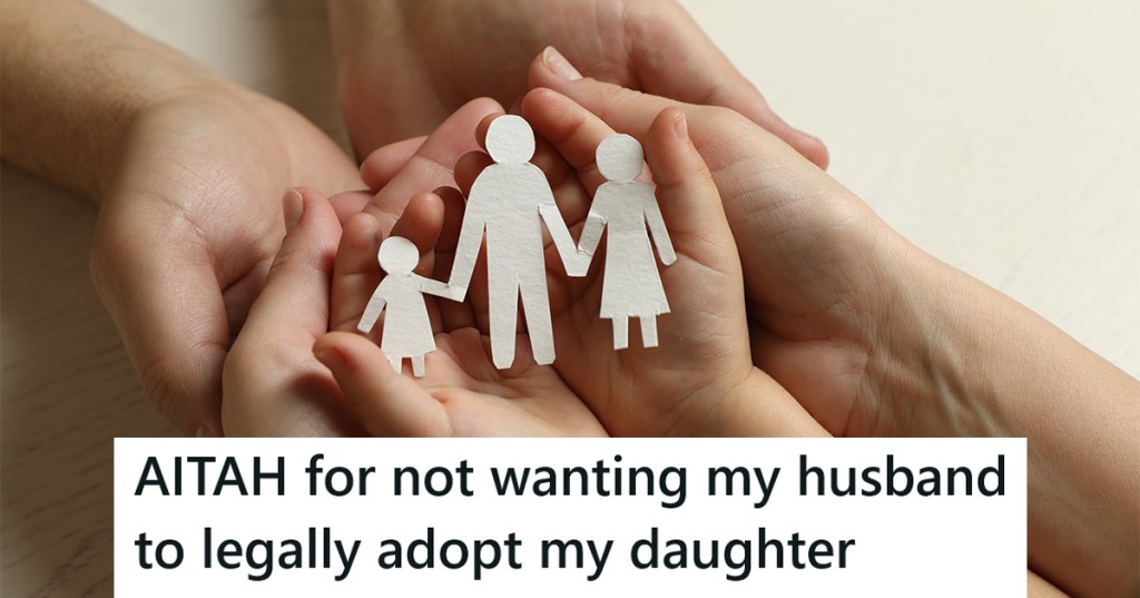 Family's hands holding paper family