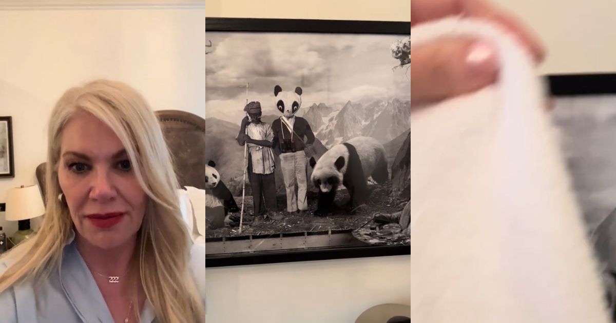 A woman in a hotel room with a creepy painting