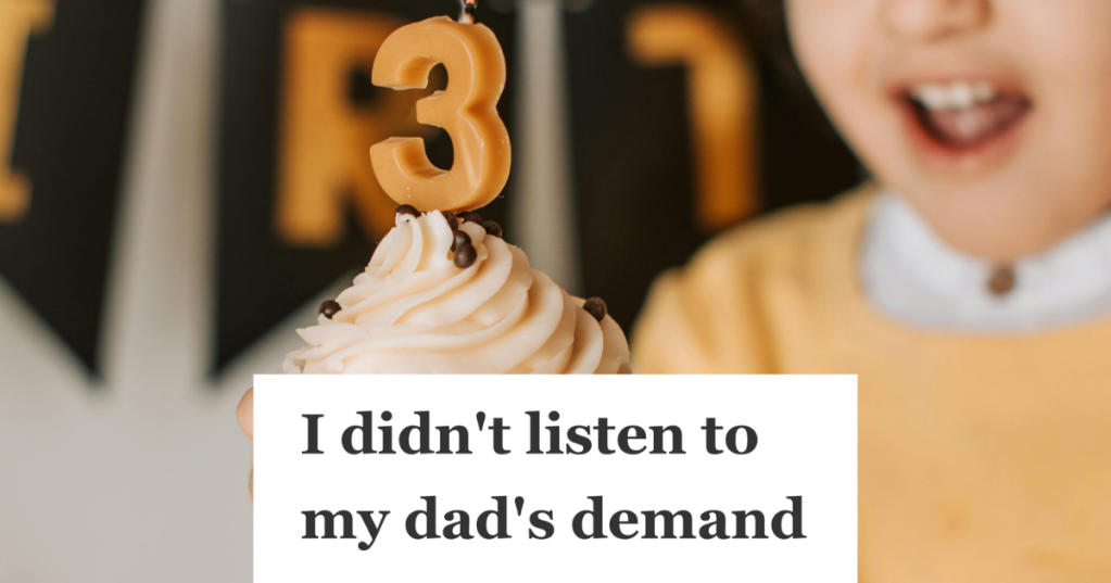 little boy holding birthday cupcake