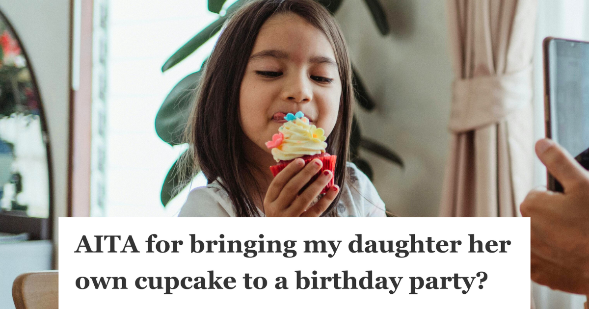 little girl holding a cupcake