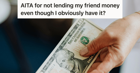 man holding 10 dollar bill