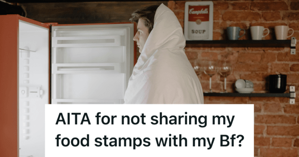 man looking in an empty fridge