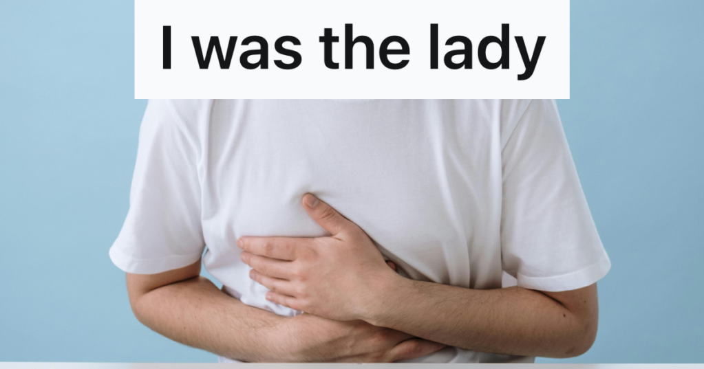 man with a stomach ache clenching stomach