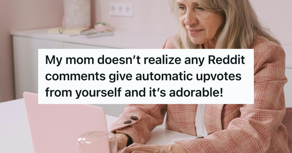 older woman using pink laptop