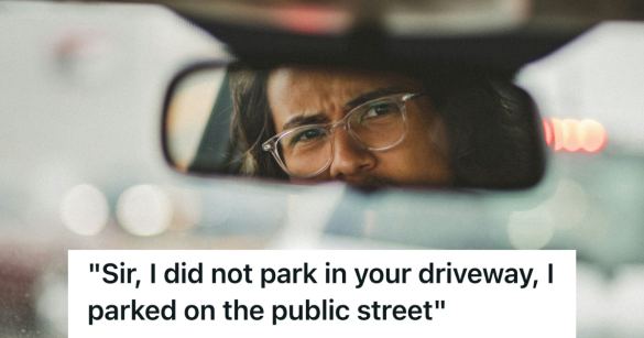 person scowling in their rear view mirror