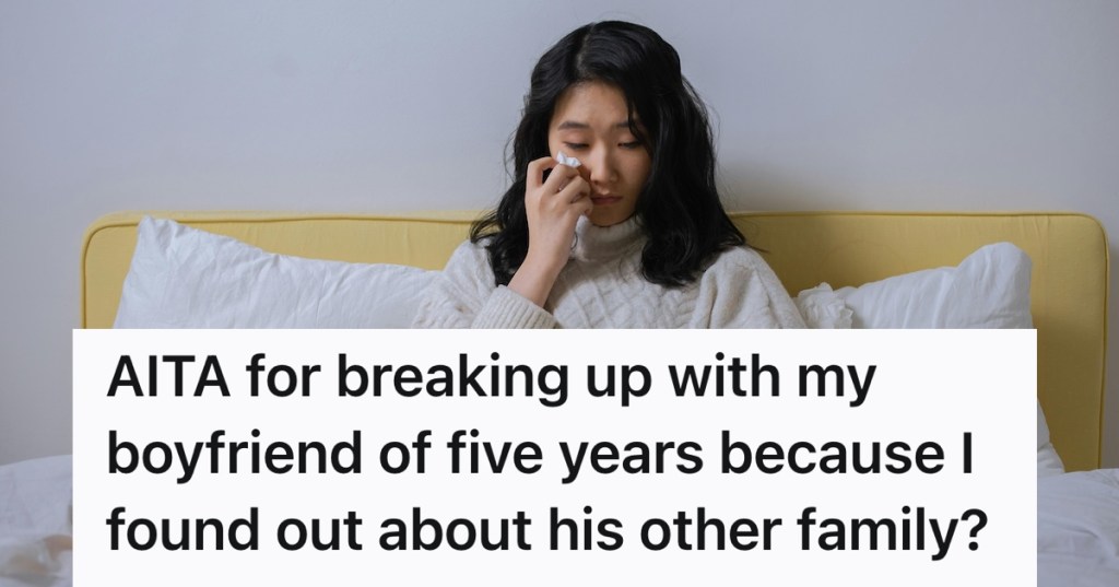 woman sitting in bed crying