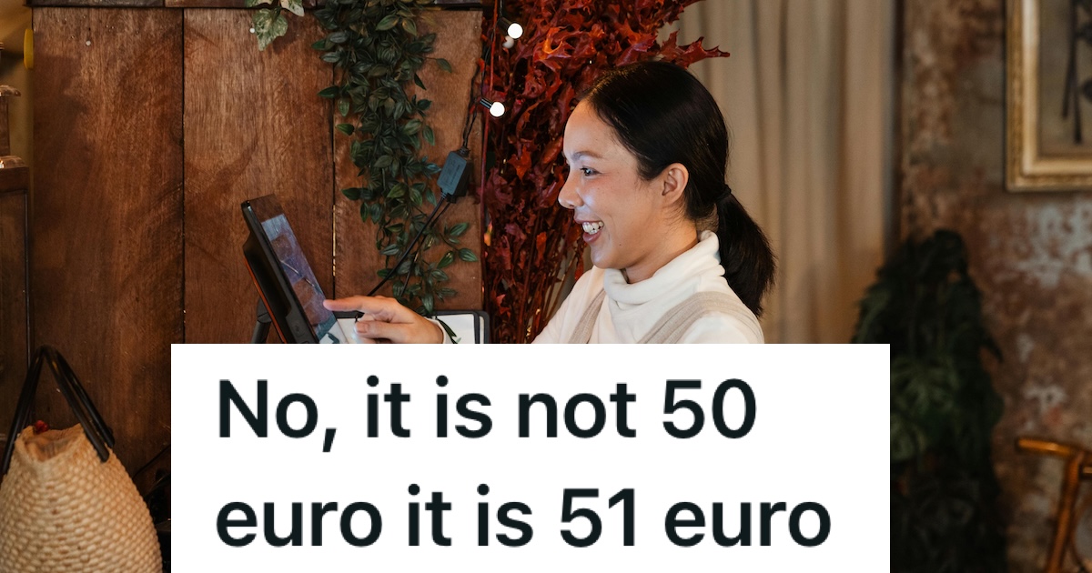 smiling cashier at a cash register