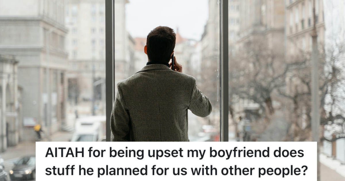 man talking on the phone while looking out a window