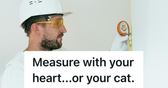 man in hardhat using a measuring tape