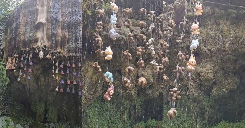 Stuffed animals hanging from Mother Shipton's Cave