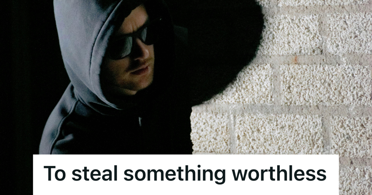 thief wearing black hood and sunglasses