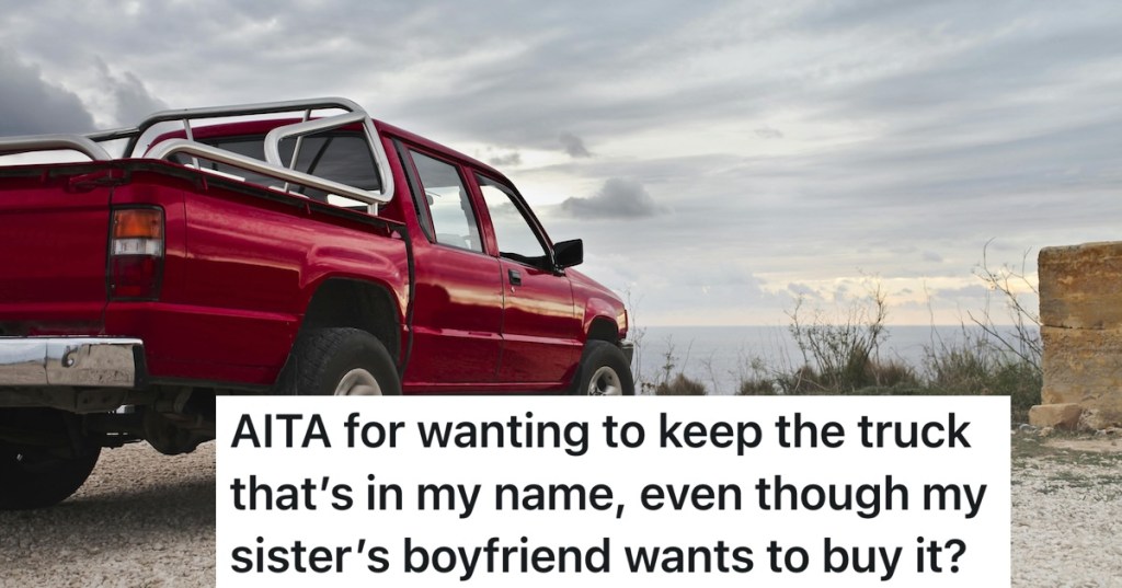 red truck parked on dirt road