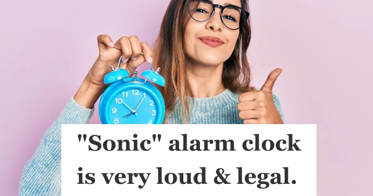 woman holding an alarm clock