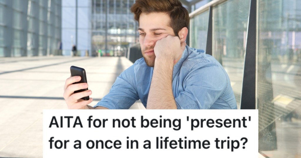 young man looking at phone