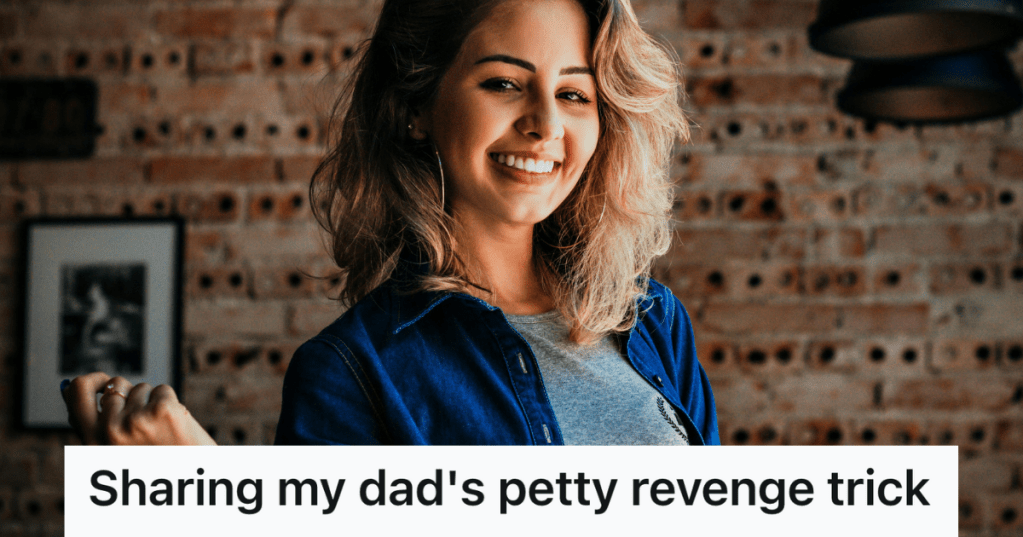 woman smiling against a brick wall