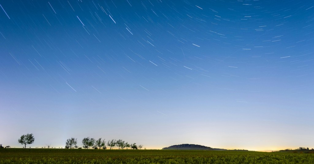 A meteor shower above a field