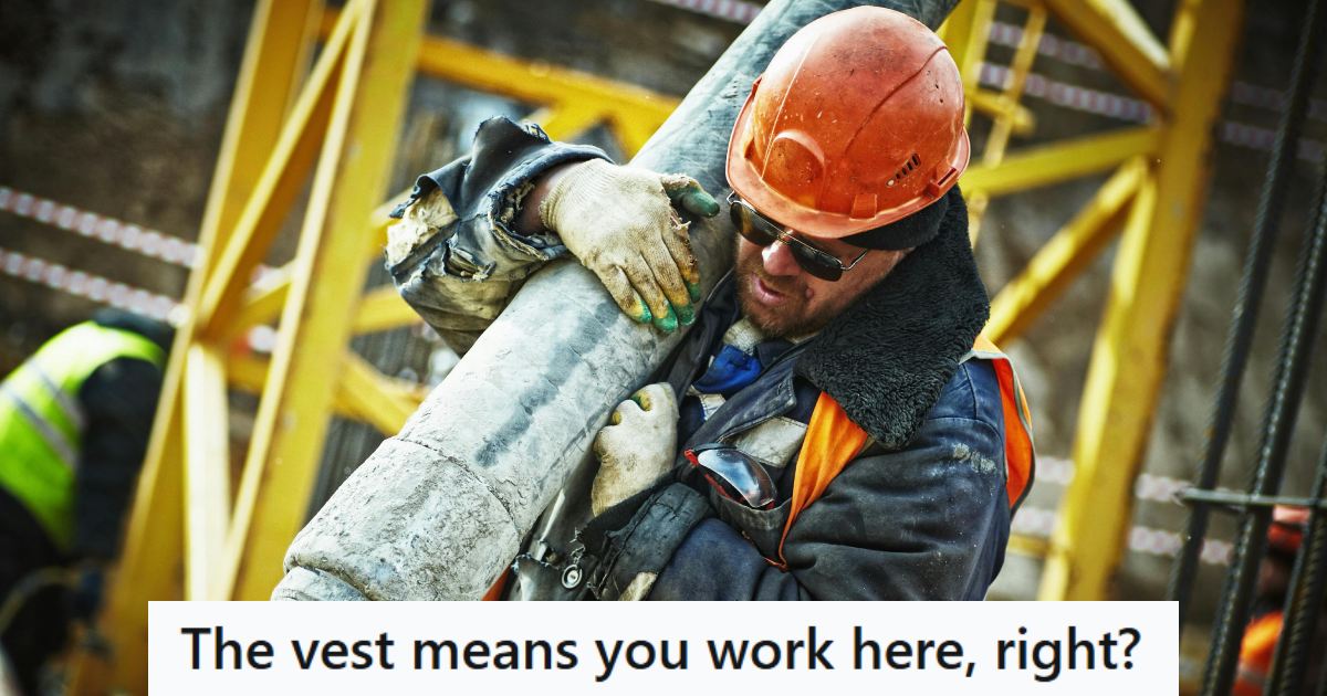 Large man working as a construction worker in a bright vest
