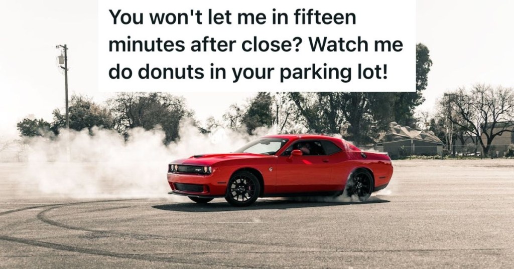 Red car drifting in a parking lot