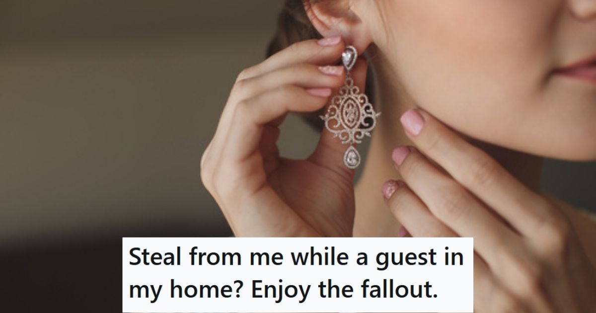 Woman putting on earrings