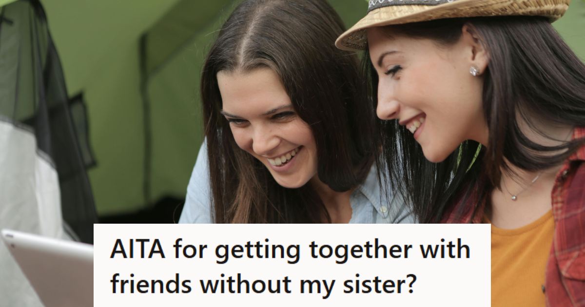 Two women smiling and talking to a third person via a tablet