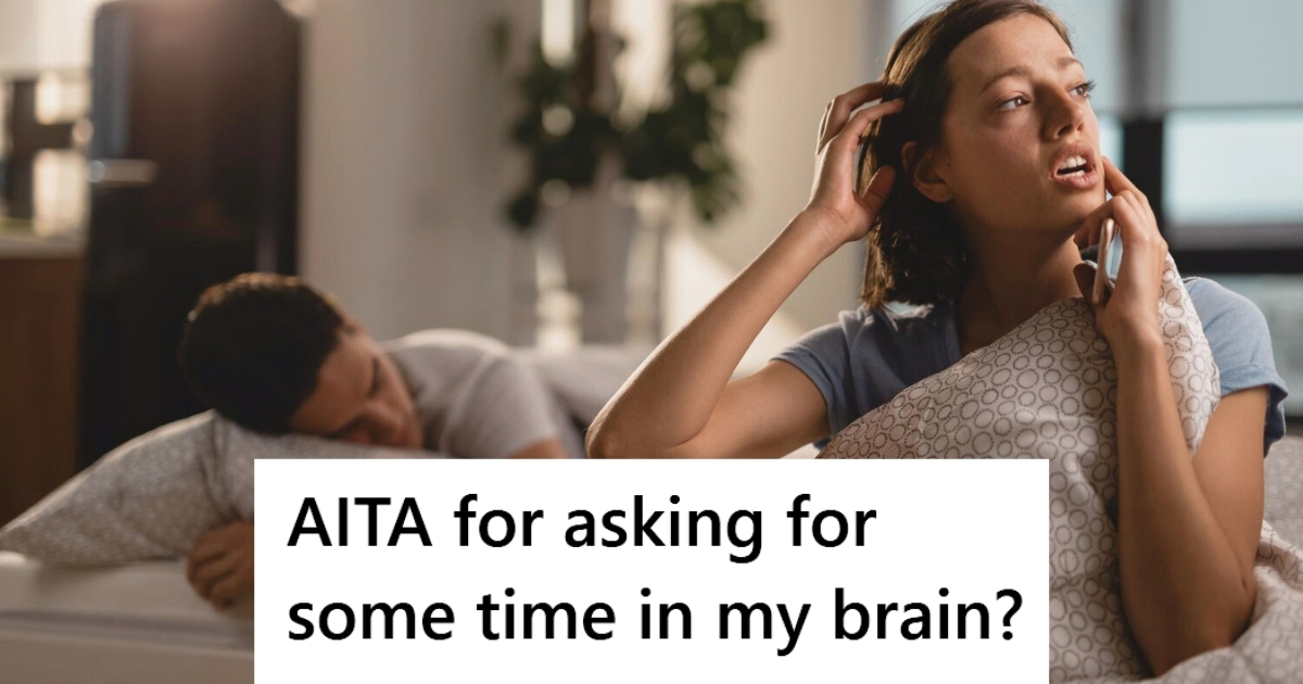 Woman using smartphone while man sleeps