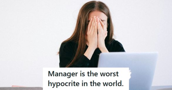 Woman who is stressed out and covering her face at her Apple Computer