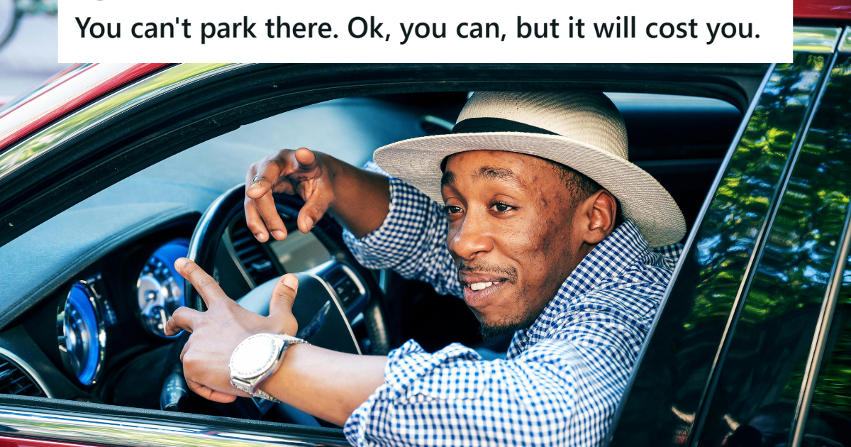 Man in hat playing around in his car