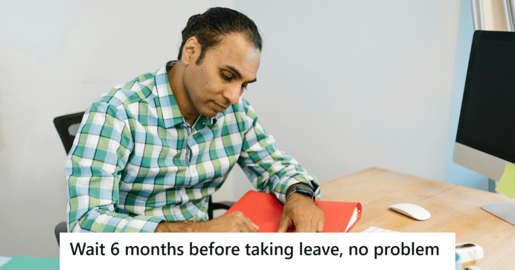Man in checkered shirt working in his office