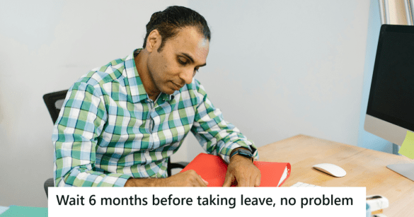 Man in checkered shirt working in his office