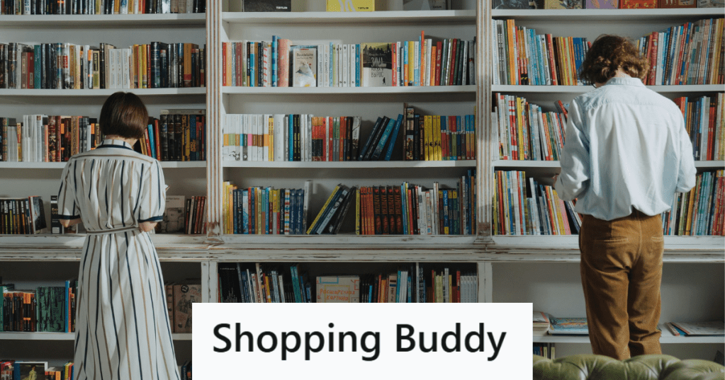 two people looking at books near a shelf