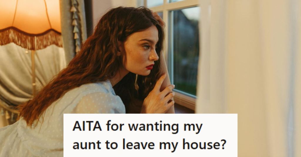 Young woman looking out the window, pondering what to do