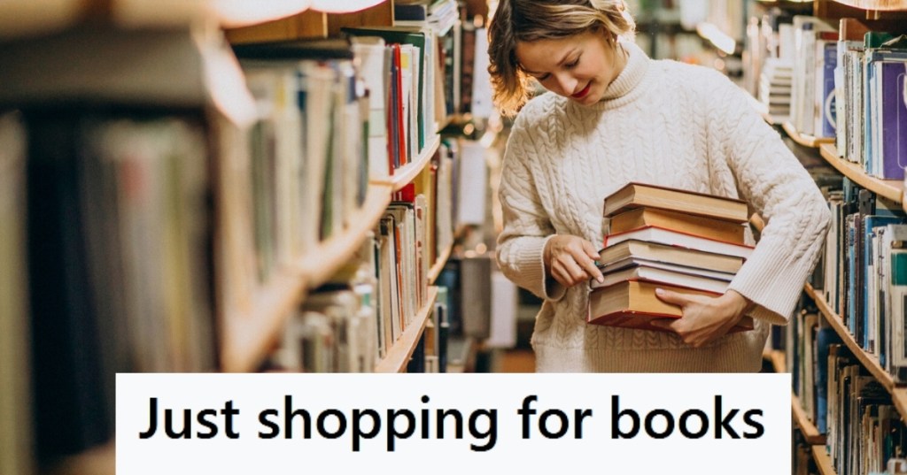 Woman carrying books at library