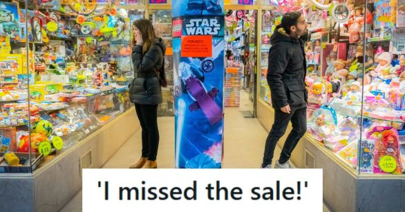 Woman and man shopping in a popular toy store before Christmas