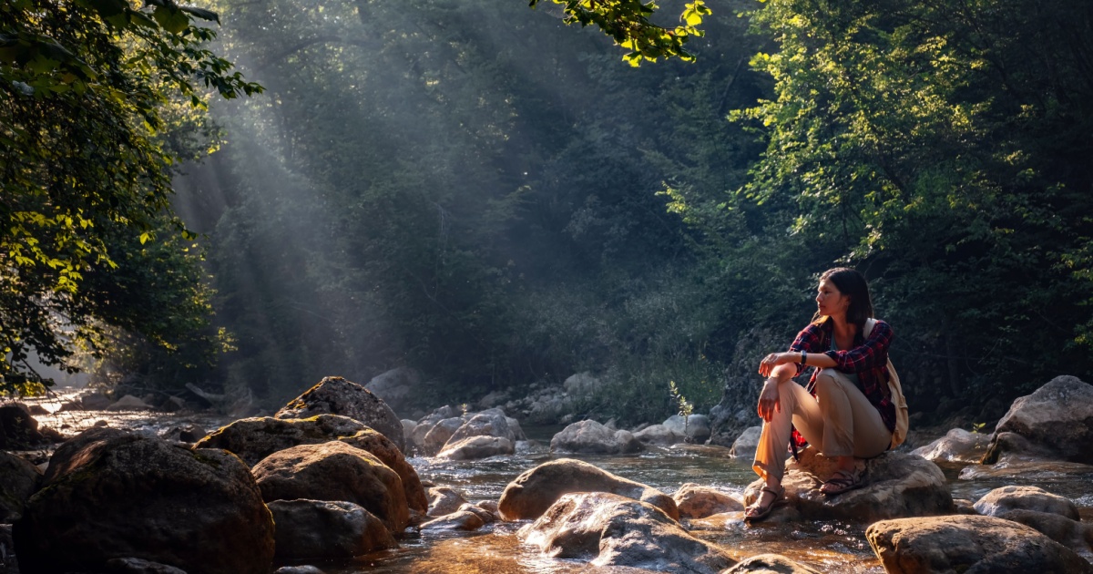Woman by a river in nature